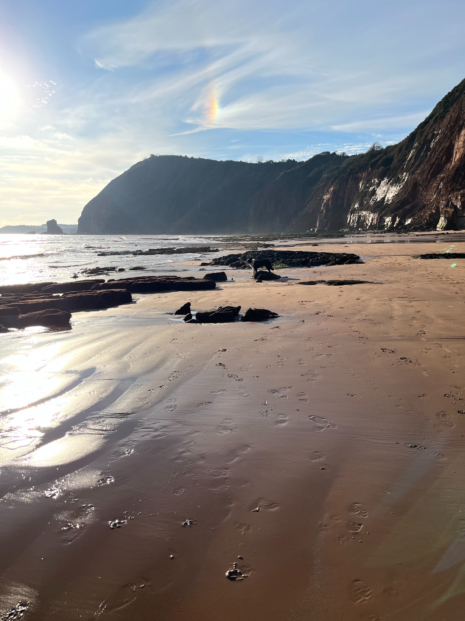 Wide beach beneath cliffs